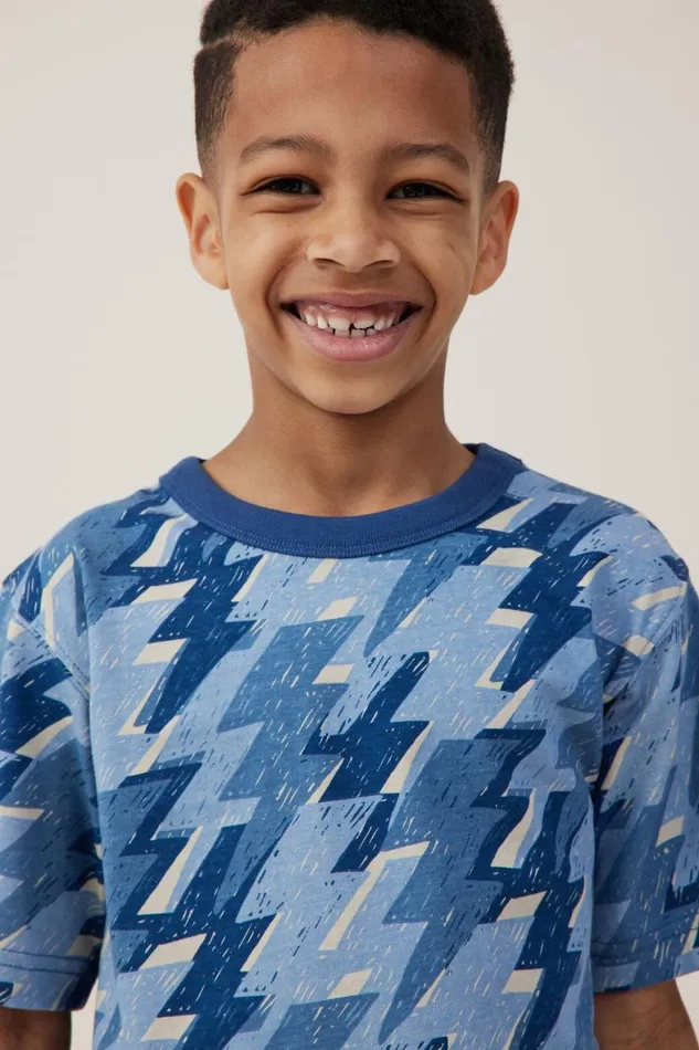 Boys 214 Tops and TShirts Cotton On Jonny Short Sleeve Print Tee Dusty Bluelightning Bolt Yardage